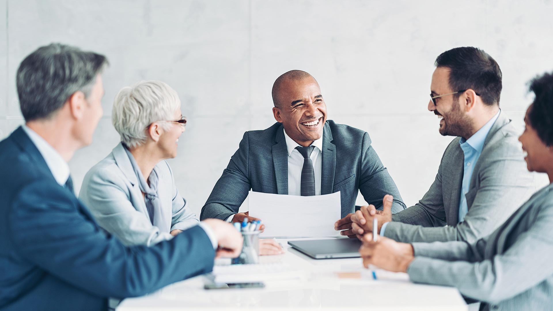 Multiracial group of business persons having a meeting