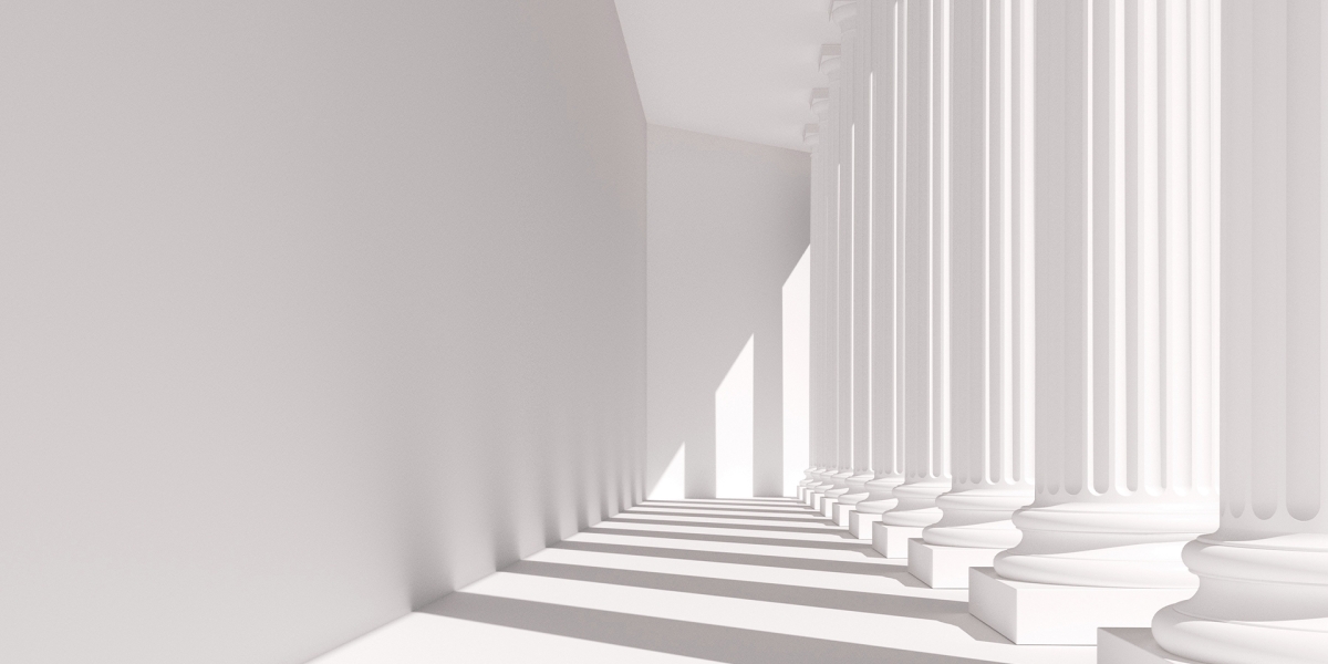 White Building with large, Greek style columns and Shadows