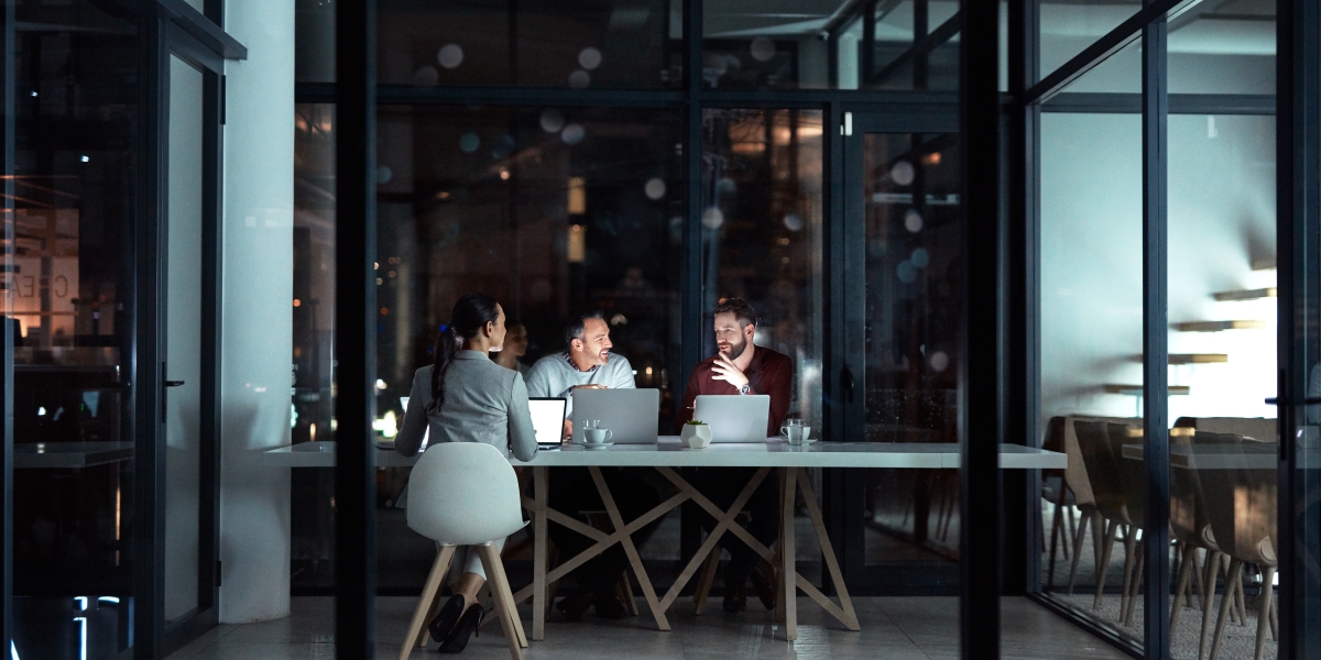 coworkers sharing ideas and information in a meeting room